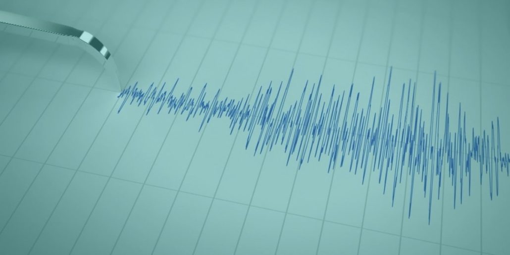 a seismograph measuring earthquake magnitude